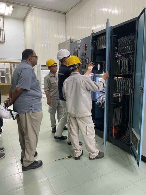 IronPeak engineers calibrating a power plant control panel