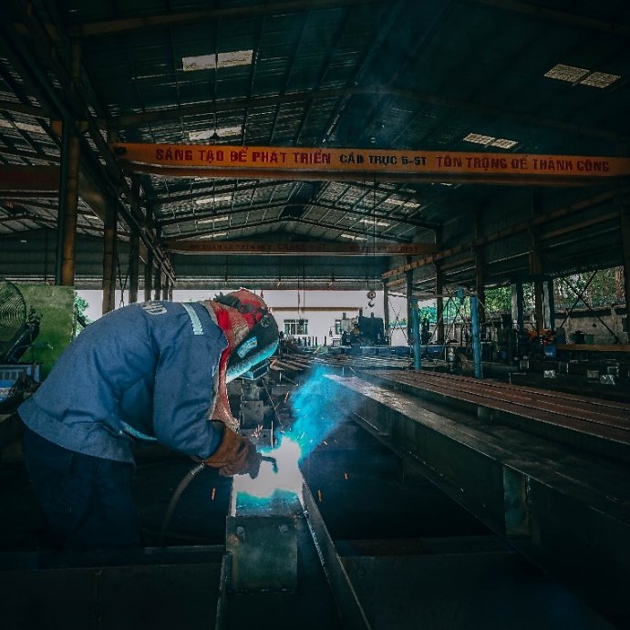 IronPeak welder fabricating a steel component at the Phu My workshop