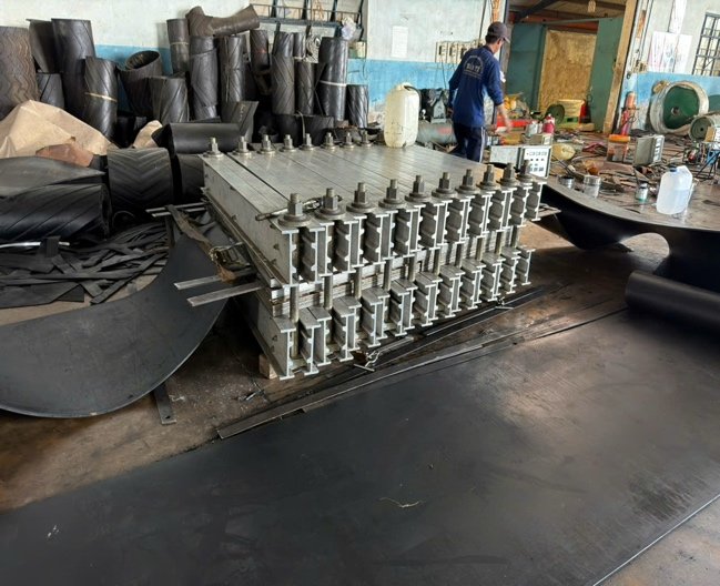 Steel plate and belting materials staged at the fabrication facility